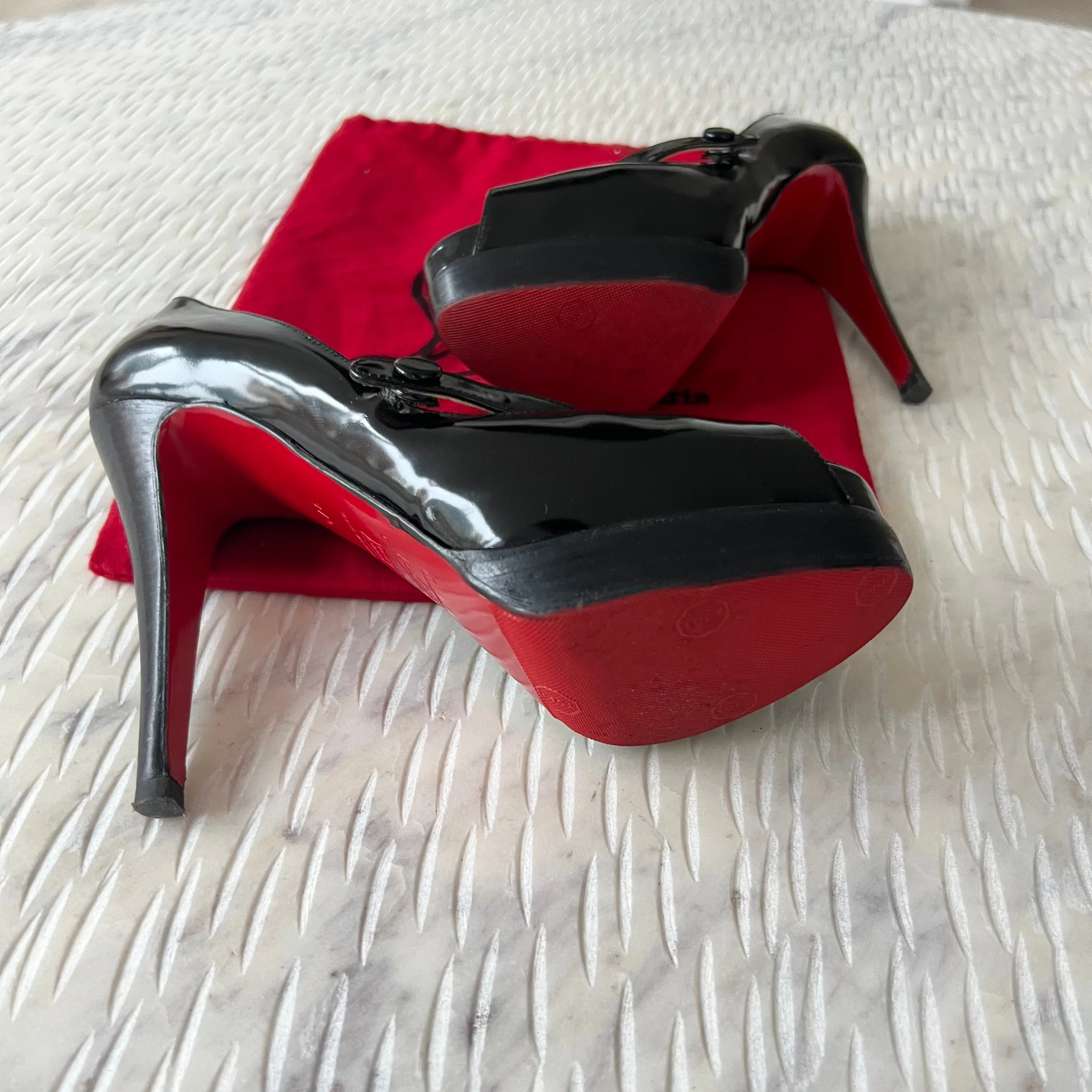 CHRISTIAN LOUBOUTIN
Black No Barre 130mm Patent Platform
Mary Jane Peep Toe Pumps